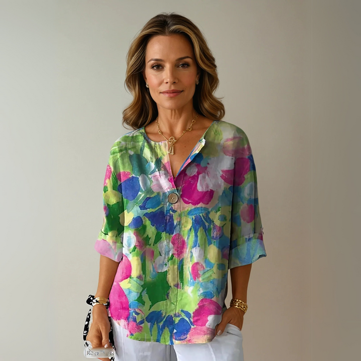 Relaxed fit women's floral V-neck shirt, a versatile printed top for everyday elegance.