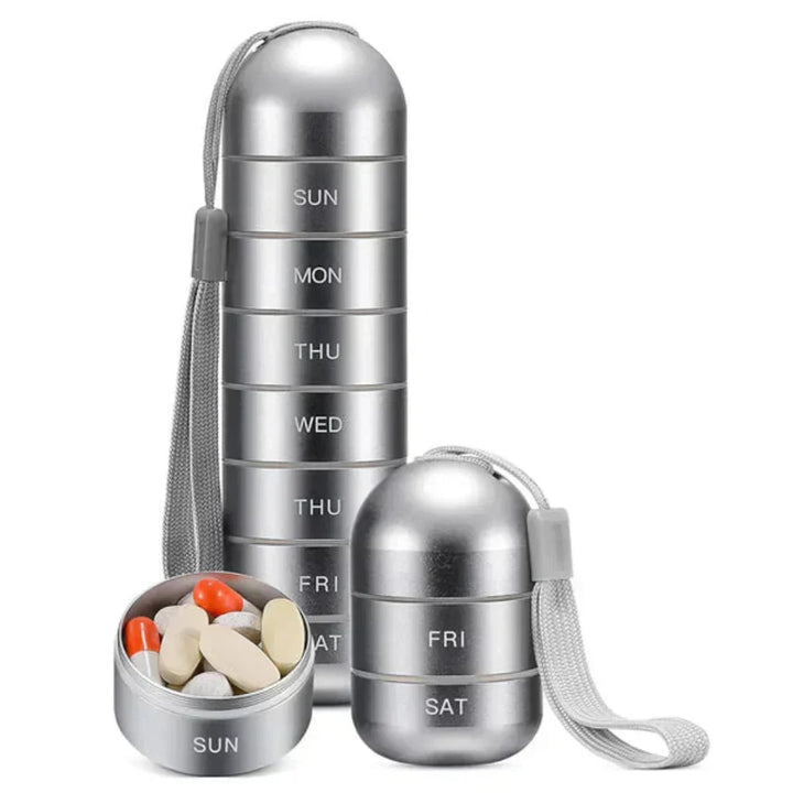 Compact aluminum alloy weekly pill organizer for daily medicine & vitamin management, travel size & waterproof.