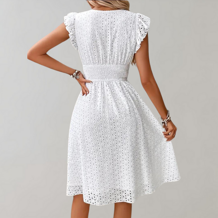 Stylish women's white summer dress. Midi length, breathable fabric, and pretty ruffled sleeves. Casual & chic.