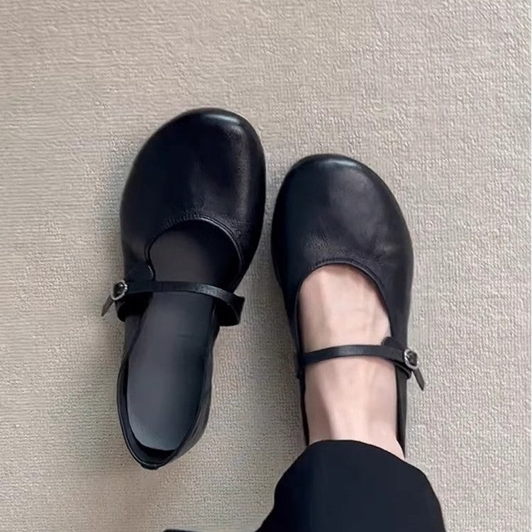 Classic style women's Mary Jane flats, featuring a stylish round toe and adjustable buckle strap.