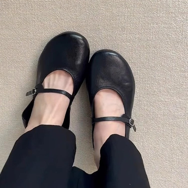 Chic women's Mary Jane flats, showcasing a sleek round toe design and practical adjustable strap.