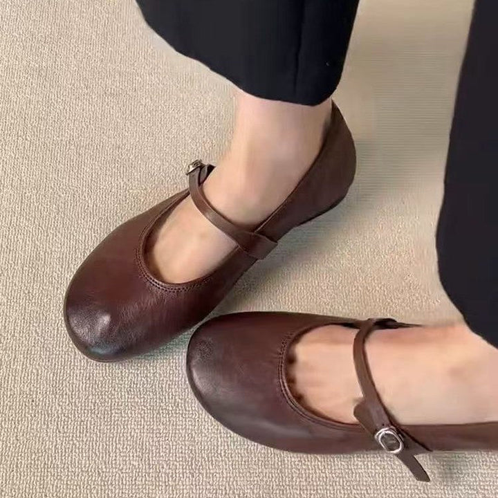 Comfortable women's Mary Jane flats with round toe & adjustable strap, great for daily elegance.