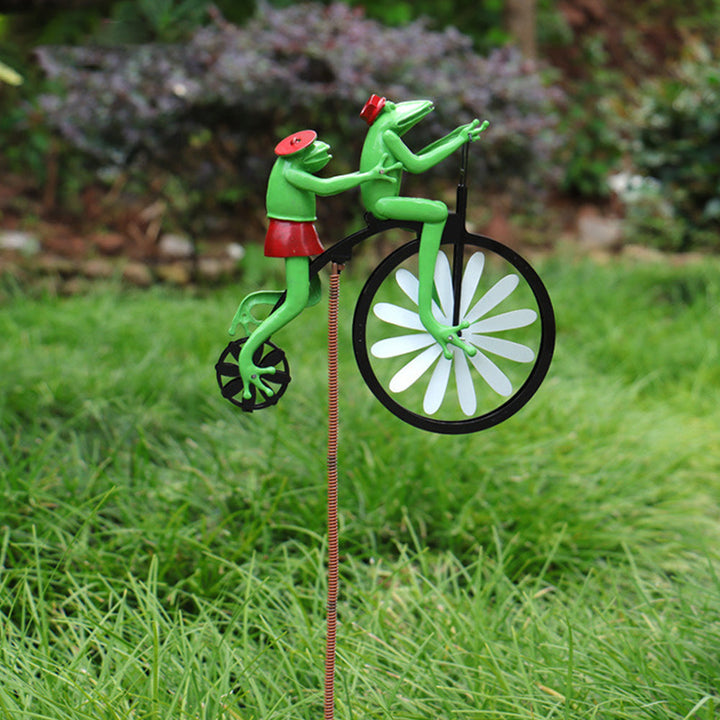 Whimsical garden windmill spinner, weather-resistant outdoor decor.