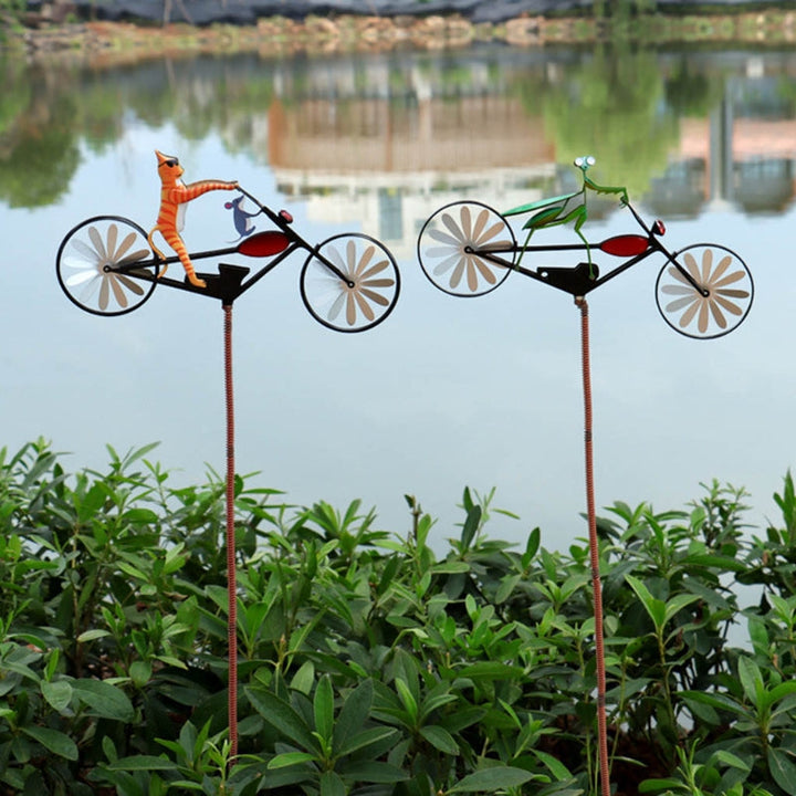 Outdoor whimsical garden windmill spinner, playful animal-themed yard decoration.