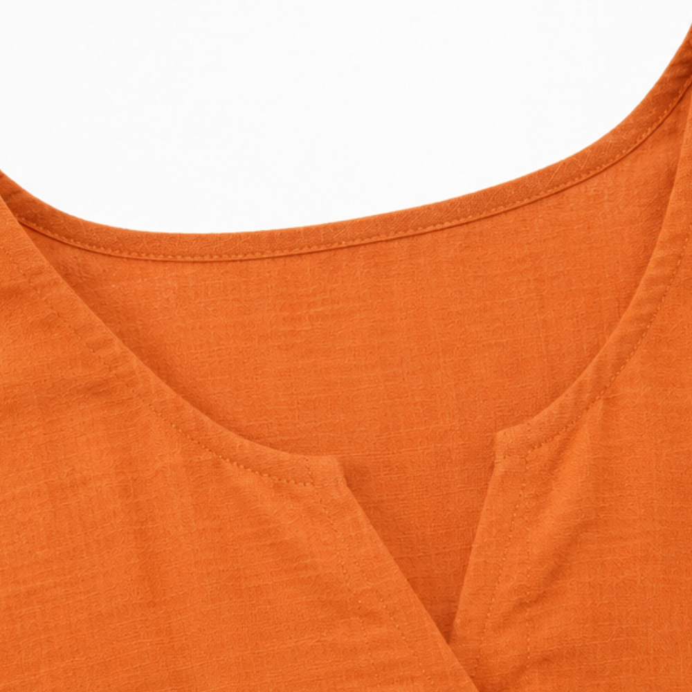 Close-up of the airy fabric and delicate ruffle detail on the Winslow women's button-front blouse.