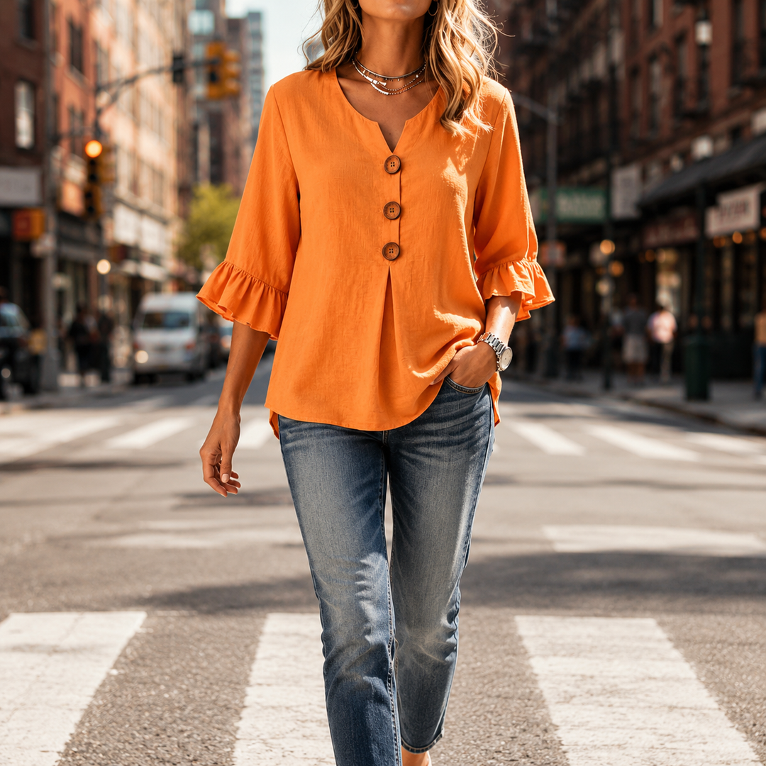 Front view of Winslow V-neck button-front blouse with elegant ruffle sleeves. Perfect for work or casual chic.
