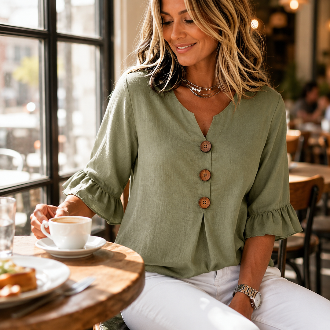 Close-up: Winslow blouse's delicate ruffle sleeves & stylish button-front. A chic spring/summer top.
