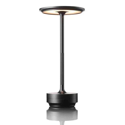 Portable modern table lamp with USB charging and dimmable wireless light for flexible home use.