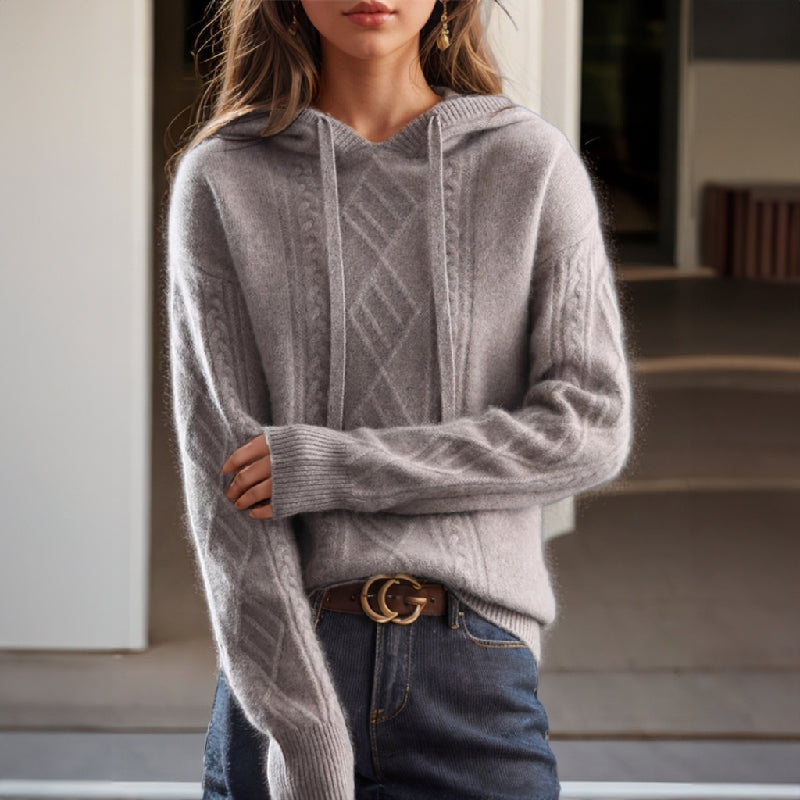 Cozy women's cable knit hooded sweater, featuring a stylish texture for warmth and everyday autumn comfort.