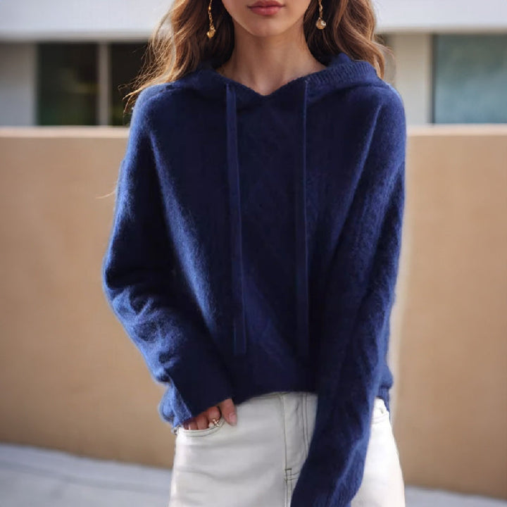Fashionable women's hooded cable pullover for a stylish, relaxed casual look. Ideal for autumn and winter wear.