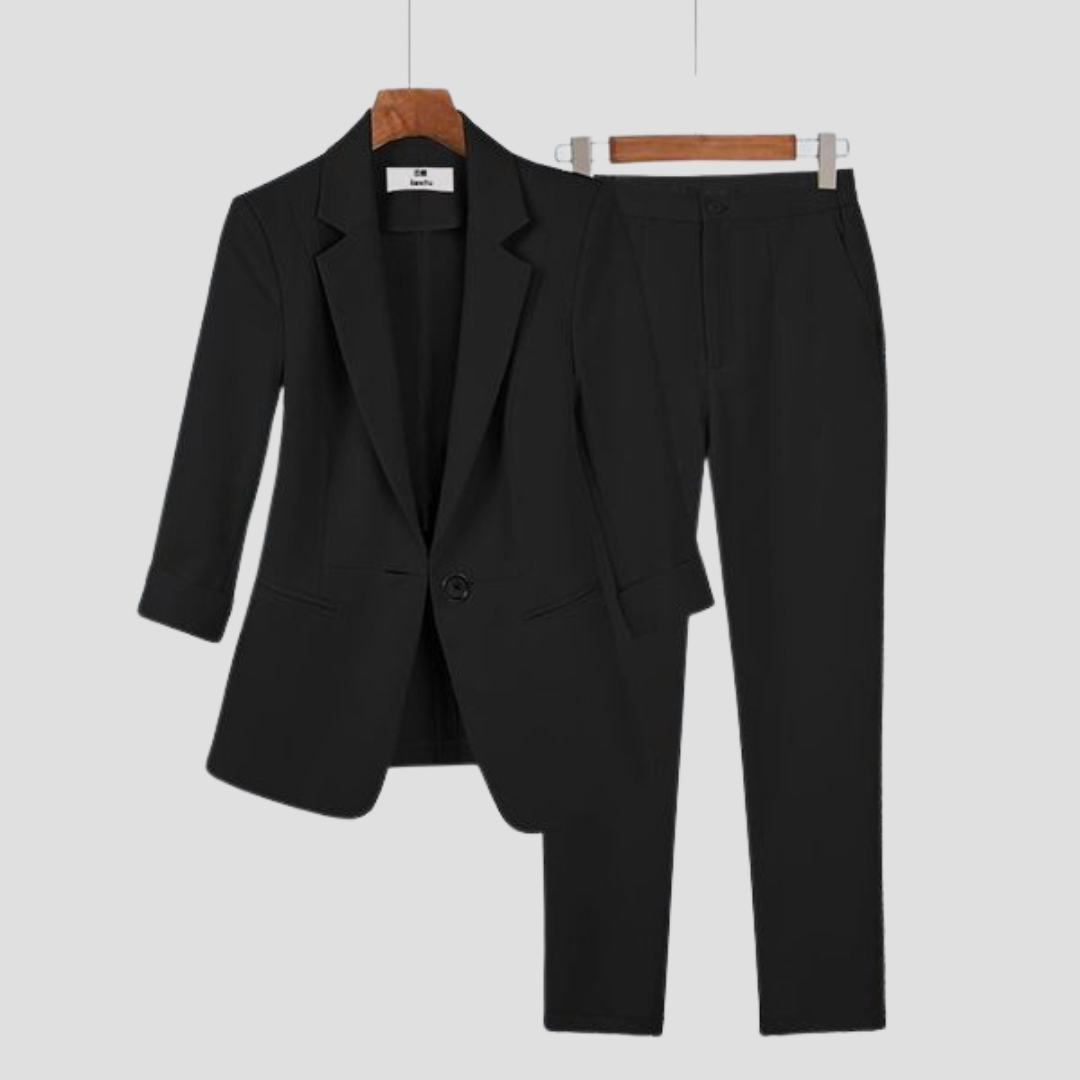 Stylish women's fashion blazer and matching trousers set. A sophisticated two-piece for diverse occasions.