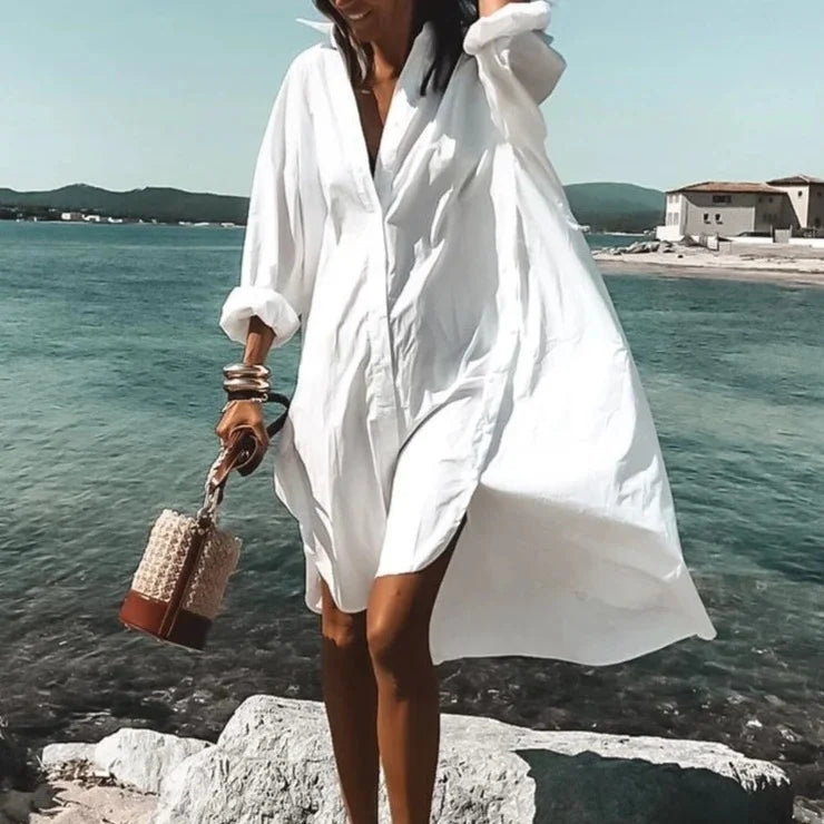 Women's stylish long sleeve beach cover-up top for sun protection and resort wear.