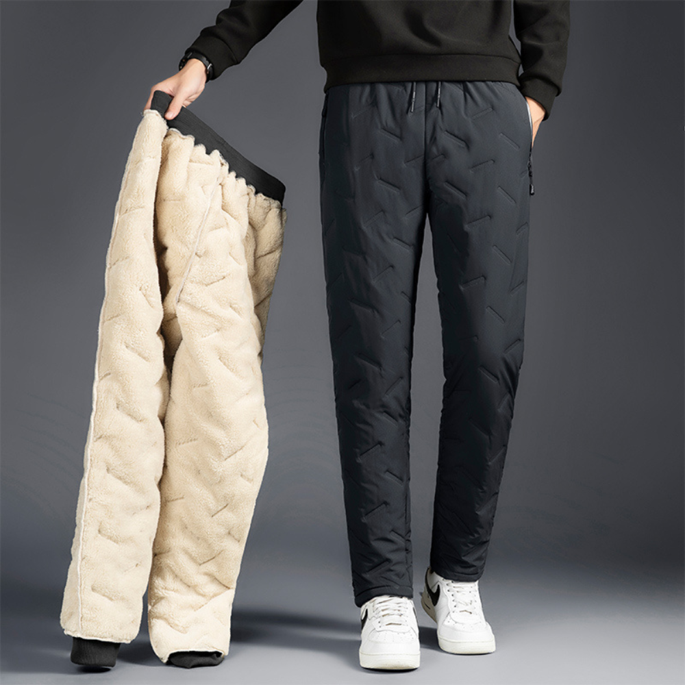 Durable women's thermal waterproof trousers, essential for winter hiking, cold weather & outdoor sports.