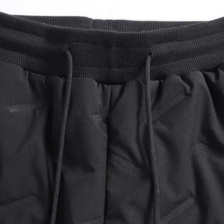 Women's insulated waterproof pants, protecting from cold during winter outdoor activities & activewear.