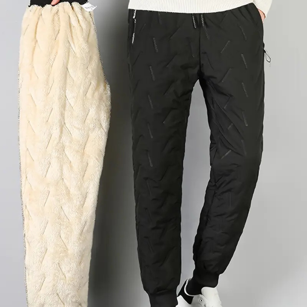 Warm women's thermal trousers, waterproof & breathable for winter outdoor sports & hiking adventures.