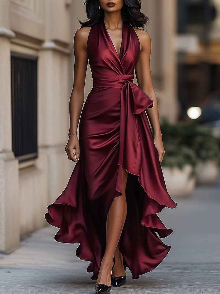 Flowy women's V-neck sleeveless wrap midi dress featuring a chic high-low hem for versatile spring fashion.