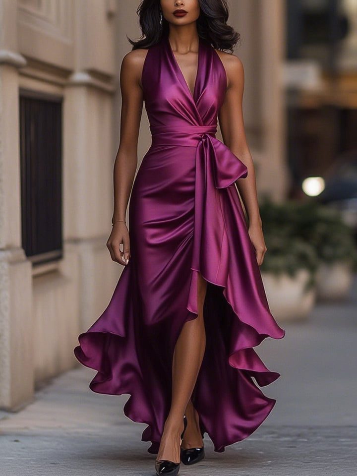Fashionable women's sleeveless V-neck wrap midi dress, featuring a trendy high-low hem; perfect cocktail attire.