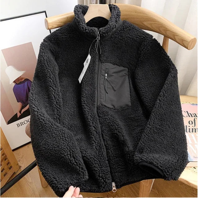 Close-up of the soft fabric on a women's comfortable zip-up jacket, ideal for cozy fall and winter wear.