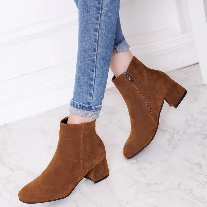 Chic ladies almond-toe ankle boots, ideal for everyday wear. Features a comfortable block heel & functional zipper.