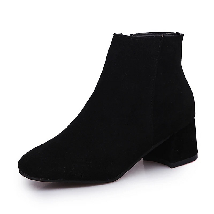 Versatile women's block heel ankle boots with a stylish almond toe. Zipper closure for ultimate comfort & winter fashion.