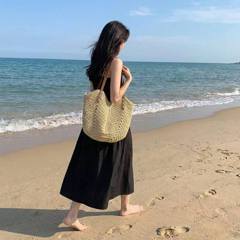 Versatile women's woven shoulder bag, a must-have summer beach tote for vacation or day trips.