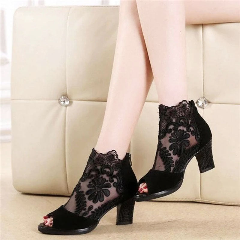 Elegant black peep toe heels, women's ankle strap shoes with intricate floral detail, ideal for formal parties.