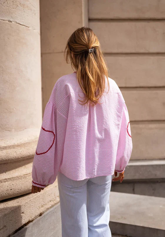 Chic women's tie-front blouse with delicate ruffles & puff long sleeves, perfect for spring fashion.