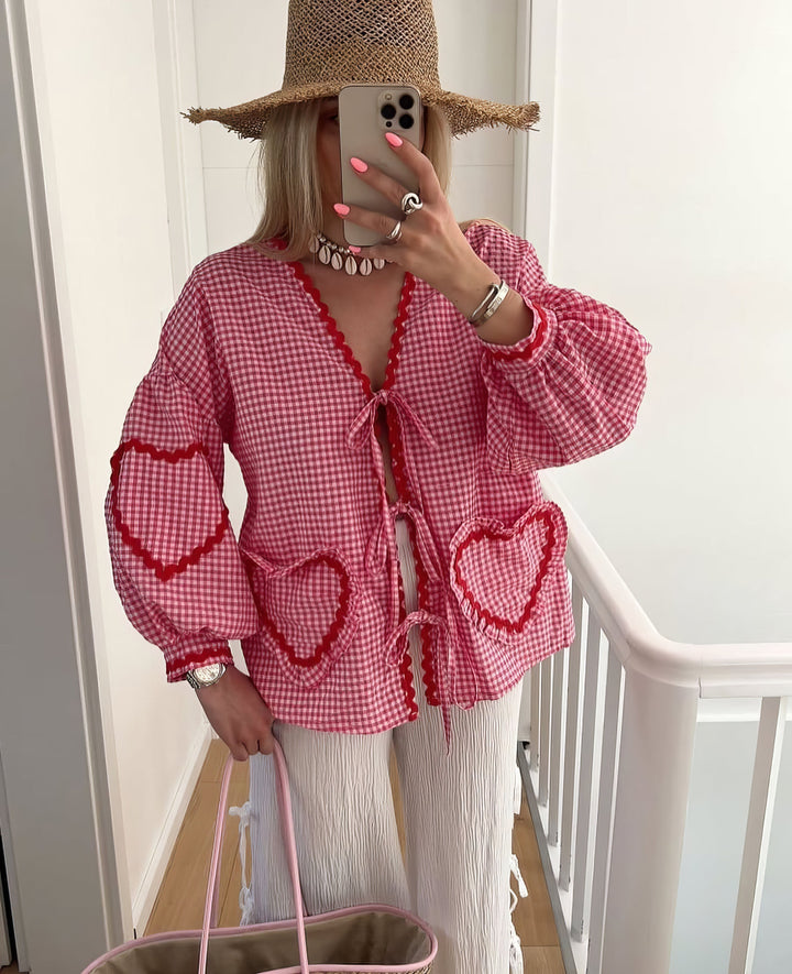 Gingham pattern women's tie-front blouse with elegant ruffle & puff long sleeves, a stylish statement top.
