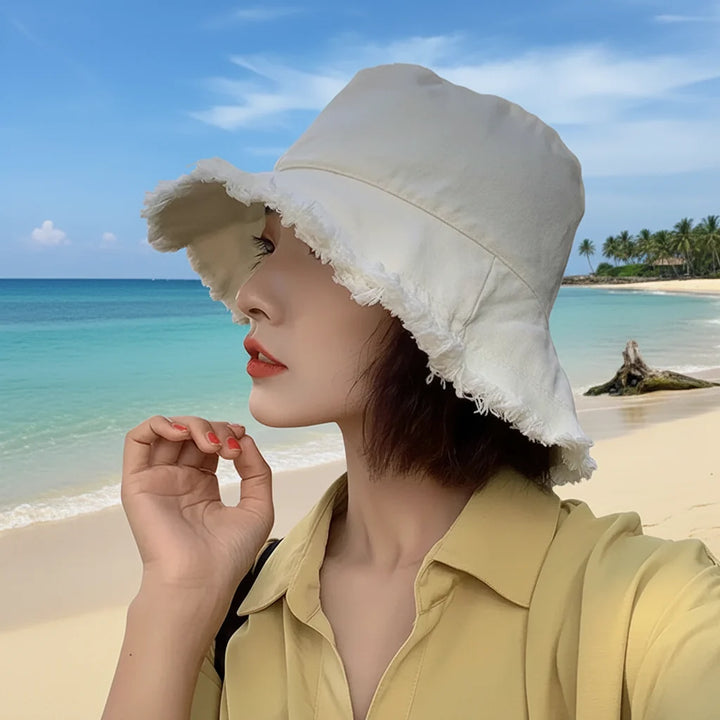 Elegant women's sun protection bucket hat. A foldable summer beach hat, perfect for travel & stylish outdoor use.