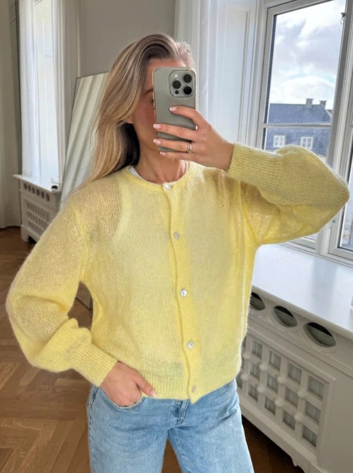 Elegant women's oversized cardigan with buttons & round neck for a chic, casual layering piece. Versatile style.