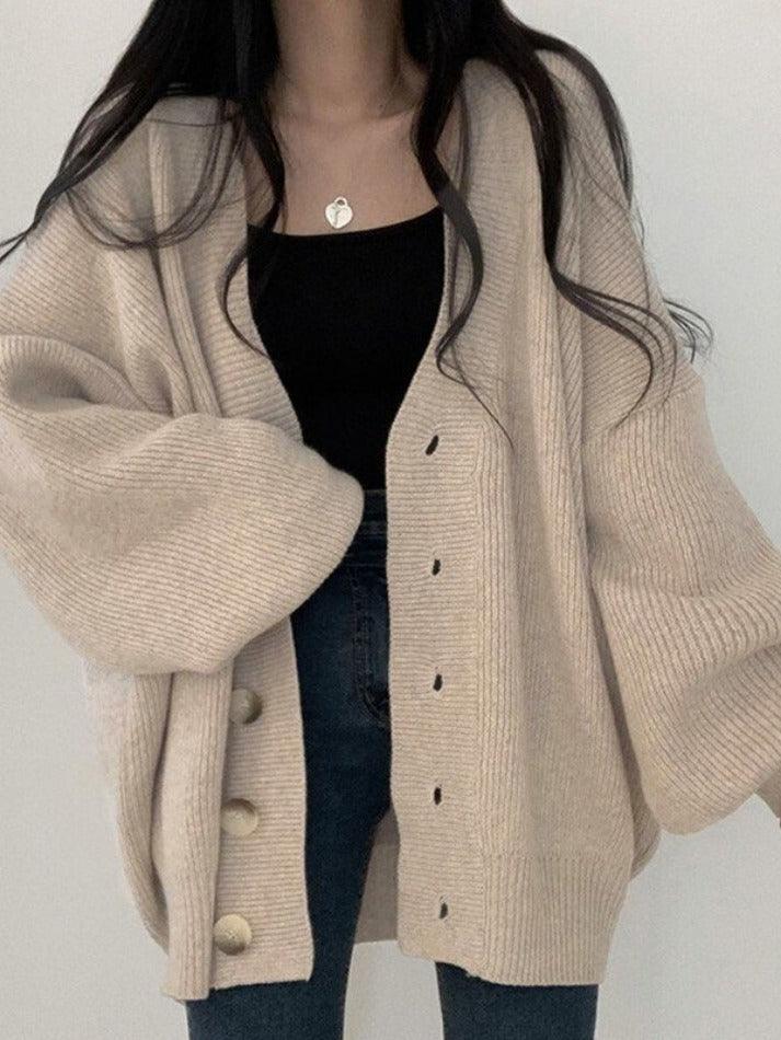 Comfortable women's oversized ribbed cardigan, a casual chic button-front layering piece for everyday wear.