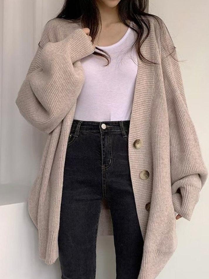 Soft ribbed knit women's oversized cardigan featuring a stylish button front, ideal for fall comfort and style.