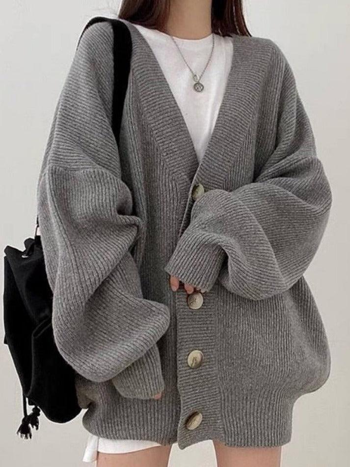 Versatile women's oversized ribbed cardigan with buttons, a perfect V-neck layering piece for casual chic outfits.