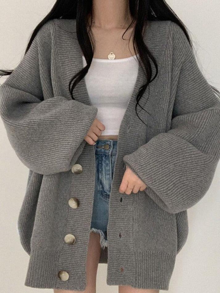 Trendy fall fashion: women's oversized ribbed cardigan, button-front style, a must-have comfortable layering piece.