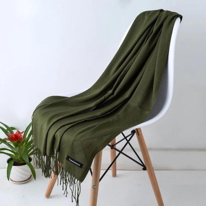Elegant women's cashmere wrap scarf, luxurious knit with delicate fringe.