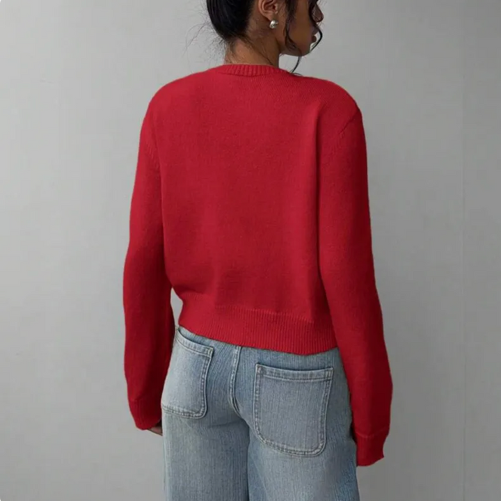 Chic women's cropped cardigan with elegant ribbed trim, a modern button-up apparel piece.