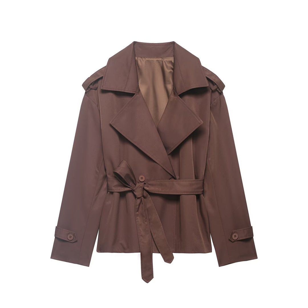 Chic women's cropped trench jacket featuring a flattering belted waist and dramatic oversized lapel for transitional style.