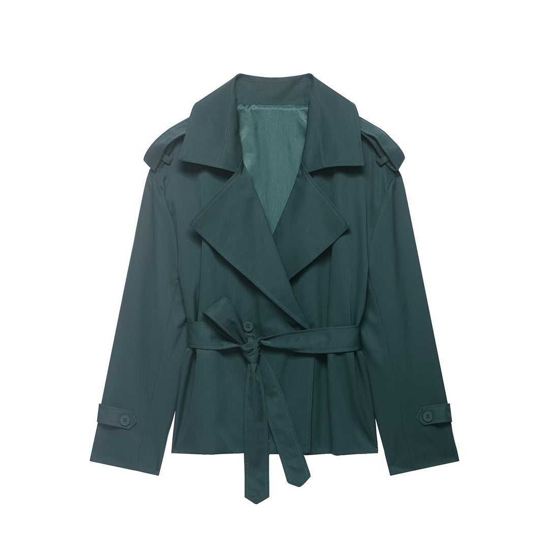 Fashionable women's cropped trench coat. Lightweight outerwear with a stylish belted waist and prominent oversized lapels.