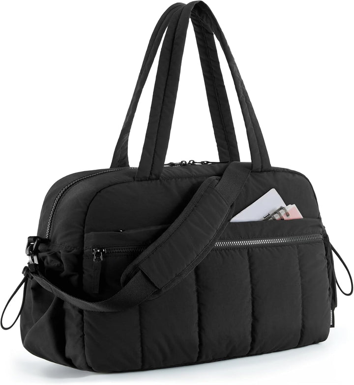 Black women's duffle gym bag, ideal for travel and daily use. A versatile and durable everyday shoulder bag.