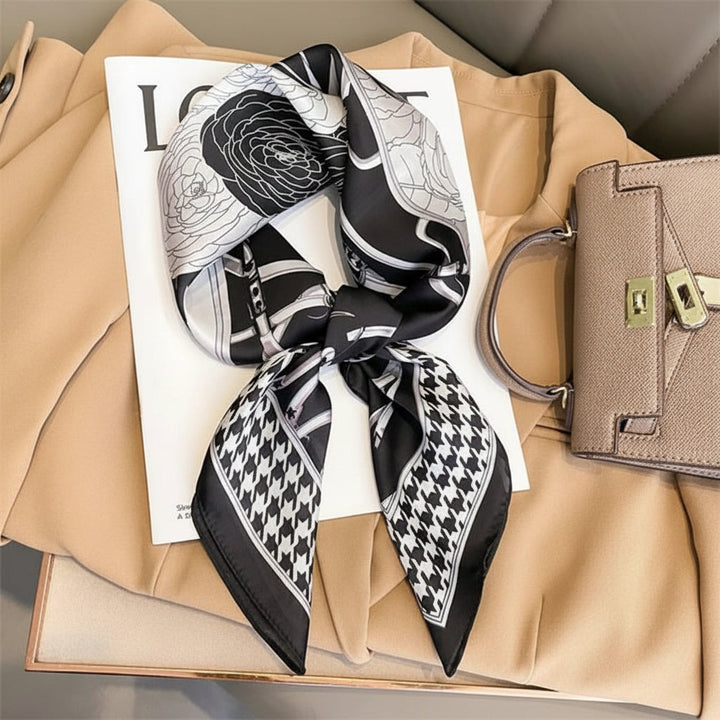 Fashionable women's scarf tied as an elegant hair accessory, adding a stylish touch.