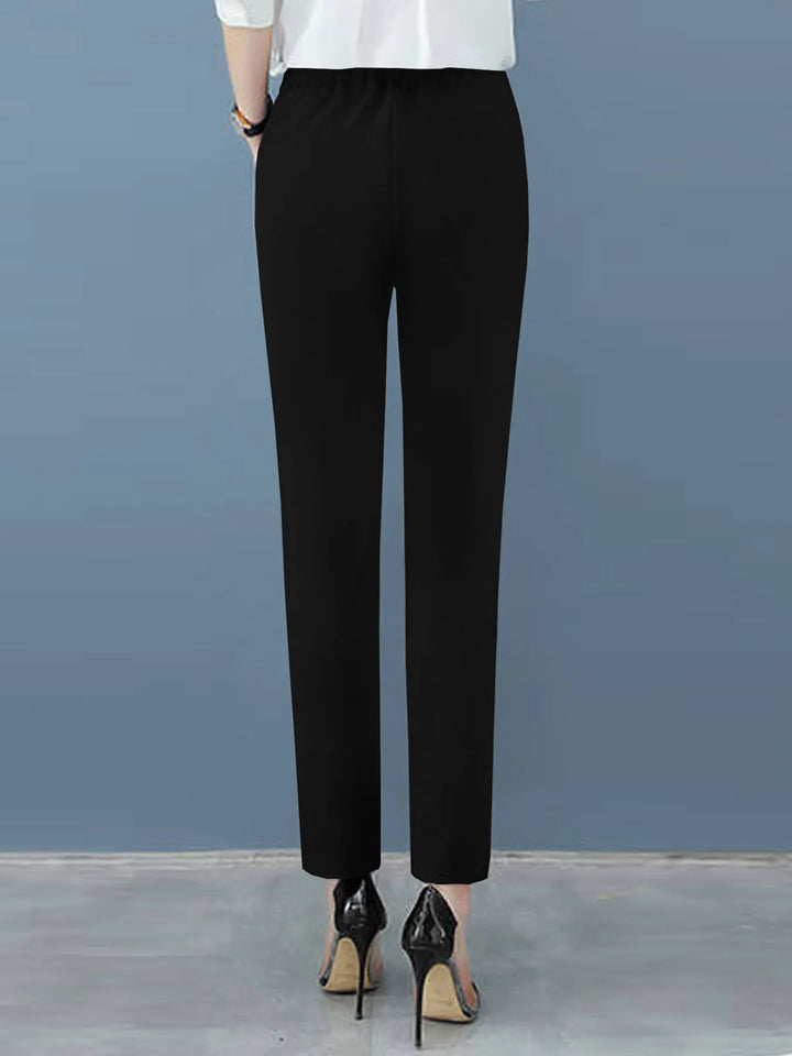 Professional women's high-waisted pleated pants, tapered leg, ideal for business casual and office wear.