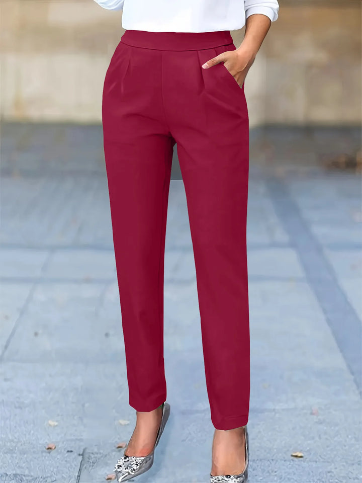 Stylish women's tapered work pants. High waist & flattering pleats offer a comfortable, chic professional fit.