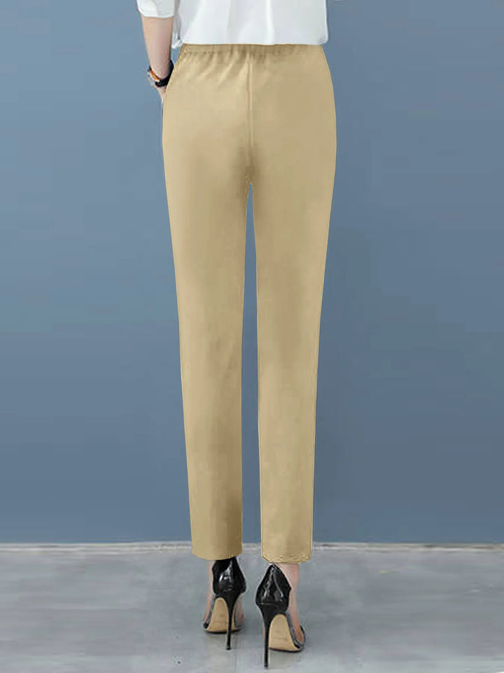 Flattering women's high waist work pants with tapered leg and pleats, excellent for modern professional attire.