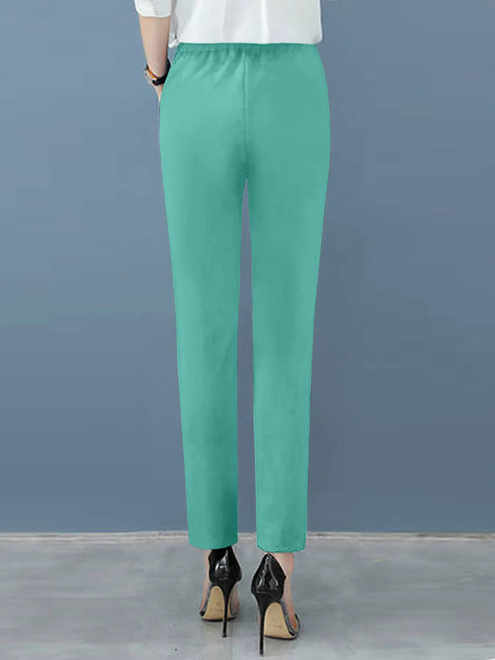 Elegant women's high-waisted pleated tapered pants, perfect for sophisticated workwear and stylish outfits.