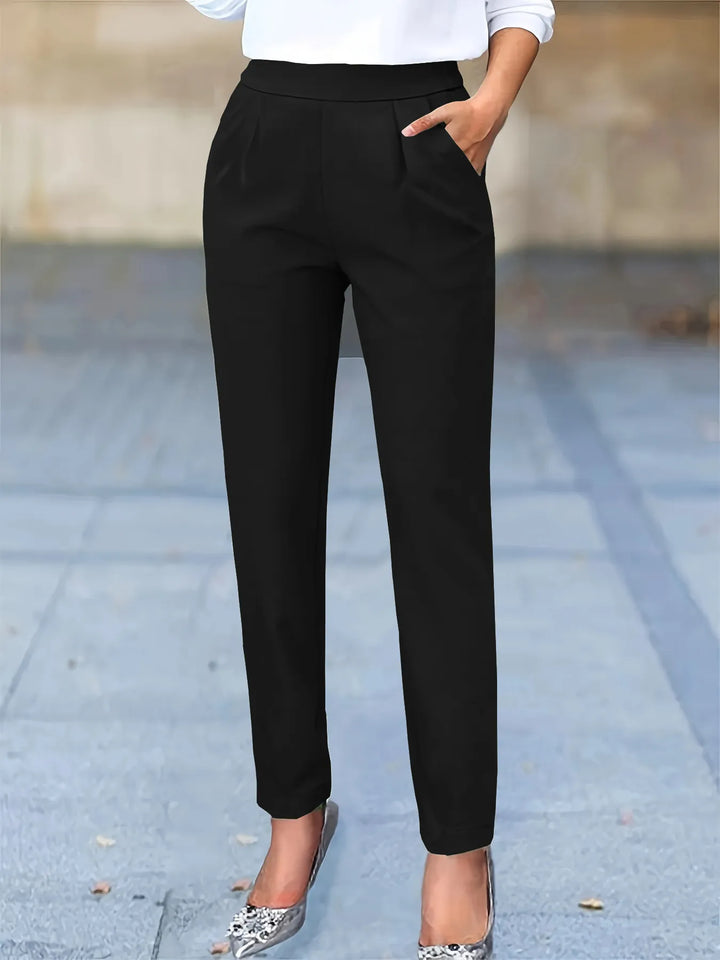 Women's high waist tapered work pants with flattering pleats for a professional, stylish office look.