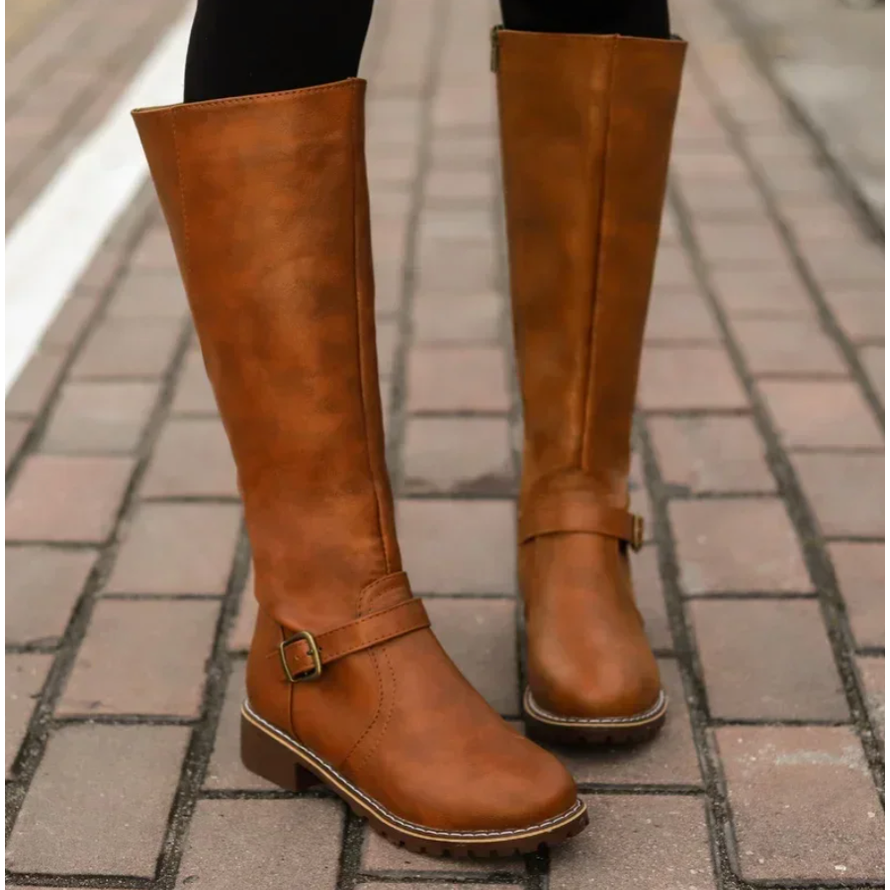 Women's riding-style knee-high boots in black with a chic buckle, functional zipper, and resilient lug sole.