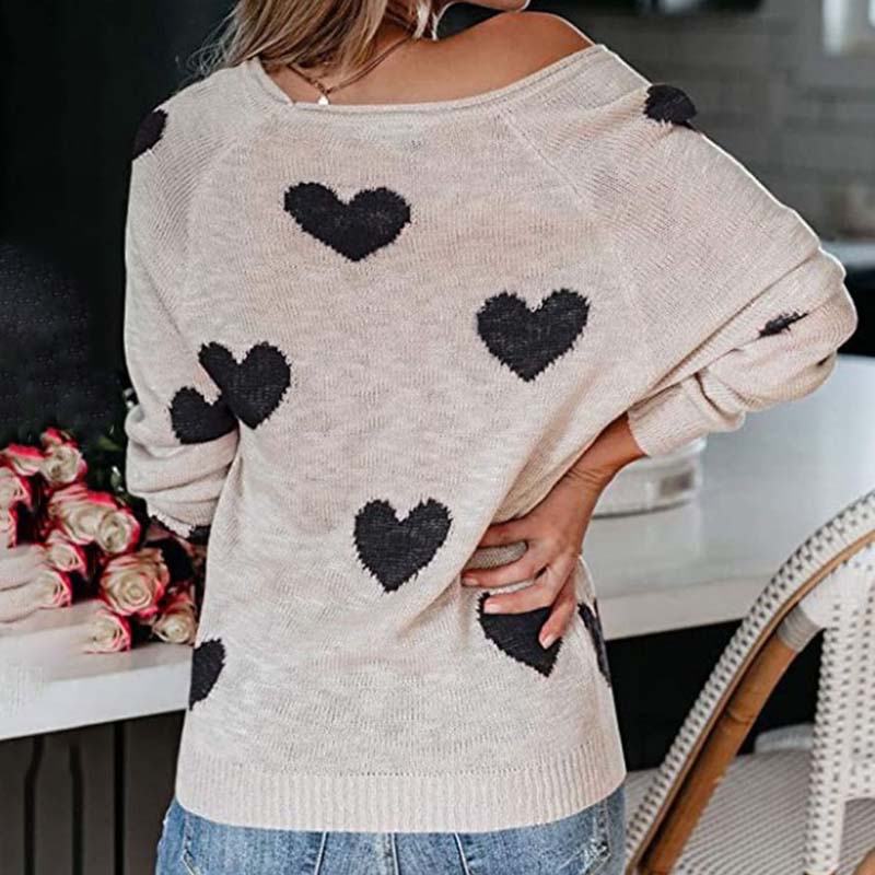 Ladies' V-neck knit top with a playful heart print, offering cozy fashion for autumn & winter.