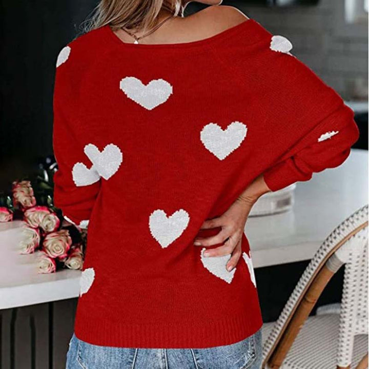 Chic V-neck patterned knit sweater for women, featuring a playful heart print for a stylish look.