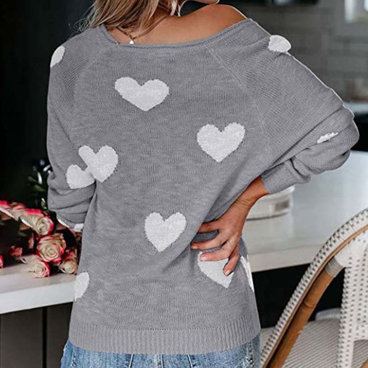 Heart-patterned V-neck knit sweater for women, a soft long-sleeve top for cozy fashion.