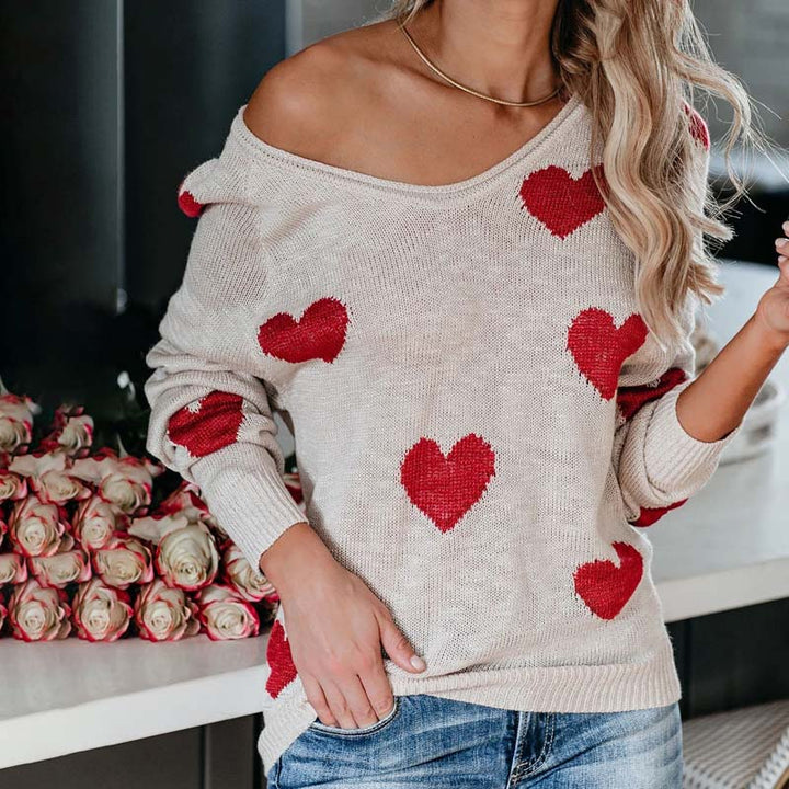 Playful heart print V-neck knit sweater for women, a cozy long-sleeve top for casual wear.